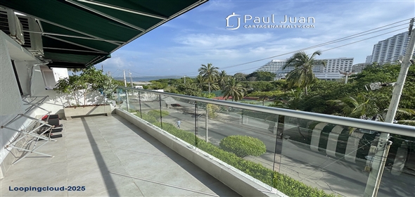 Corner of 4th Street and 5th Avenue.  Bolivar, 130001 | Stylish Two-Story Apartment in Bocagrande with Panoramic Ocean Views and Dual Balconies