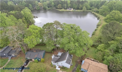 1077 Mainstreet Valley Drive Stone Mountain Georgia, 30088 | Charming Lakeside Single family Home with Peaceful Views