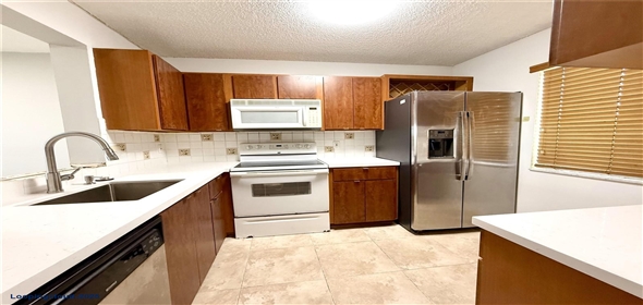 8550 N Sherman Cir # 507 Miramar Florida, 33025 | Top-Floor 2BD/2BA Condo with Lake Views in Gated Lakeshore Community