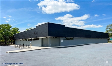 PREMIER TAMPA SHOWROOM- 13,296 SF Freestanding Building 1.42 ACRES Signalized corner LED Billboard Signage